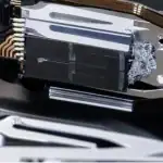 Read/write head showing media damage with particles collected from damaged hard drive surface